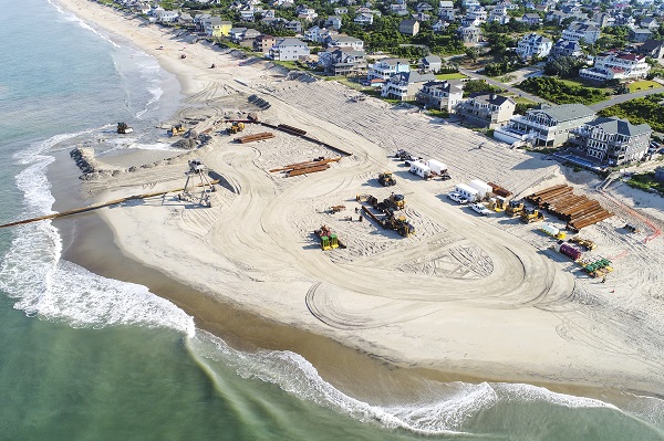 APTIM Coastal Engineering and Modeling team performing sand dredging and beach restoration to protect coastal community from sand erosion. 