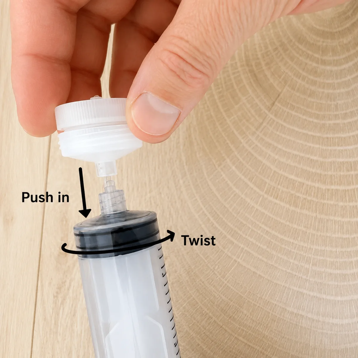 Twisting the assembled filter holder onto the syringe tip