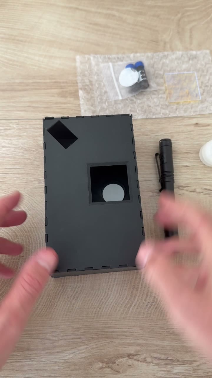 Sliding the glass slide with the filter into the imaging box