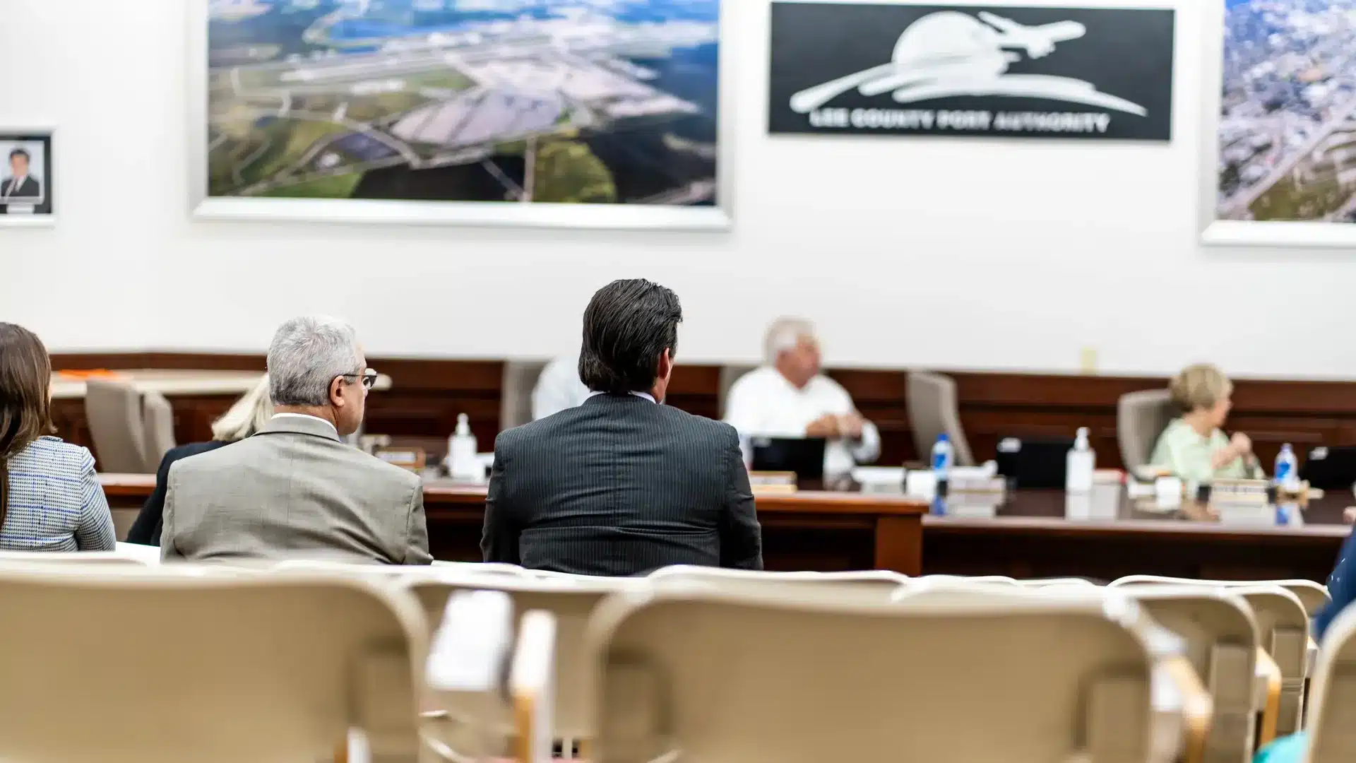 Two men sitting in the Lee County Port Authority Board Room