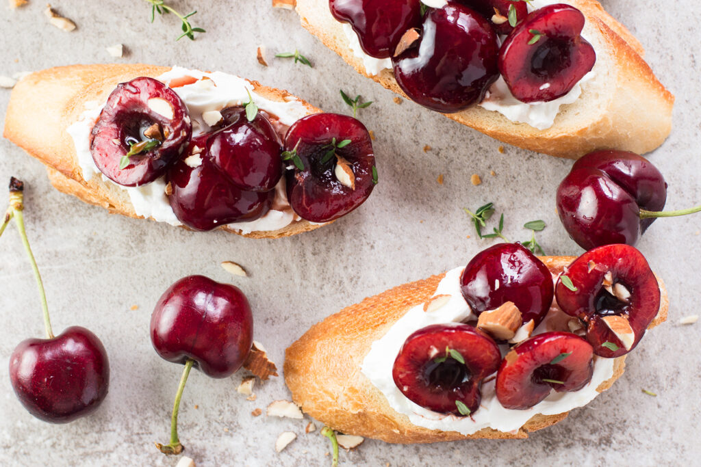 Cherry Goat Cheese Crostini with Thyme and Almonds Photo