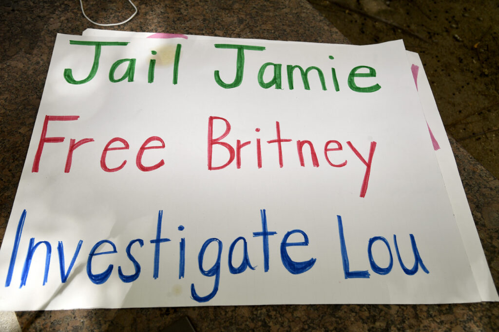 A photo of a 2020 protest sign that reads "Jail Jamie. Free Britney. Investigate Lou."