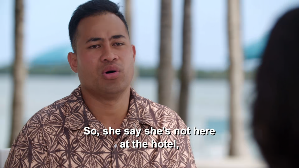 Asuelu sits on the beach, saying "So, she say she's not here at the hotel."