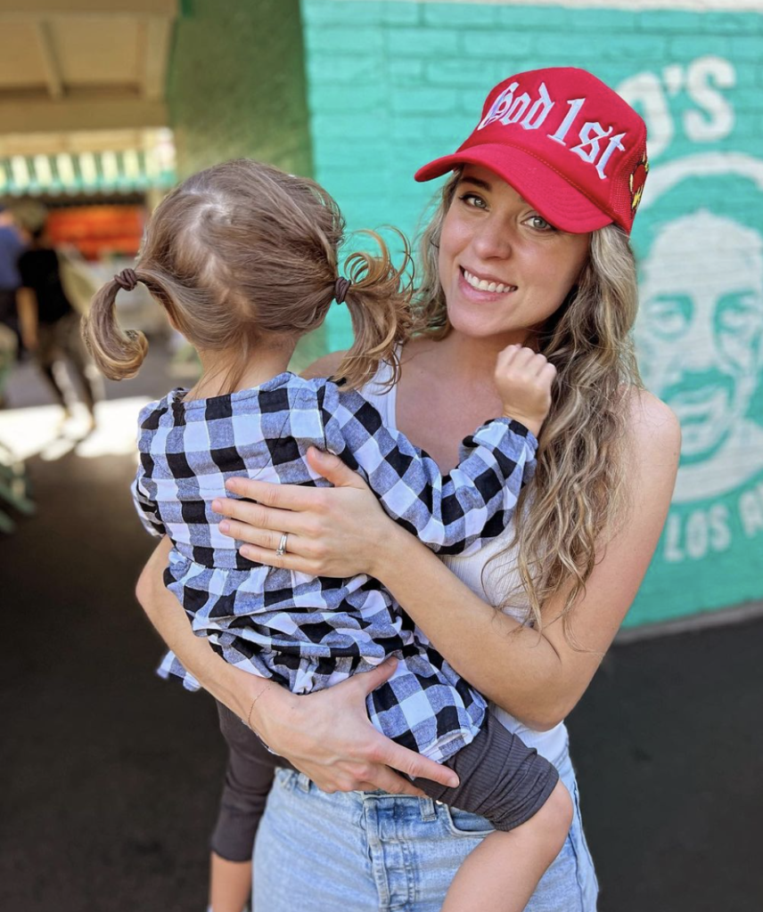 Jinger Duggar holds her daughter Evangeline in an Instagram photo.