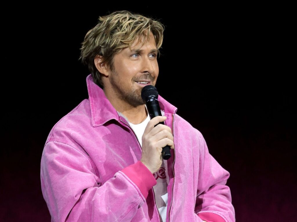 Ryan Gosling at a Barbie Event in pink jacket