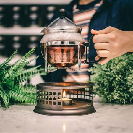 GROSCHE nairobi teapot and food dish warmer placing teaapot on tealight candle