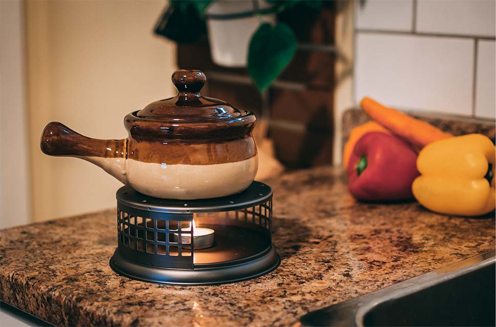 GROSCHE nairobi teapot warmer being used to warm food