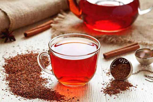 Healthy traditional herbal rooibos beverage tea with spices on v