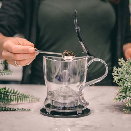 GROSCHE aberdeen loose leaf tea maker adding tea to teapot