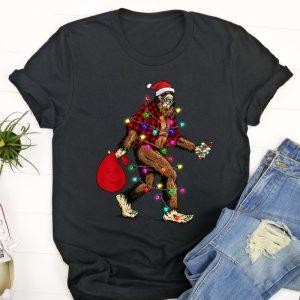 Ugly Christmas T Shirt, Bigfoot Carrying Christmas&hellip;