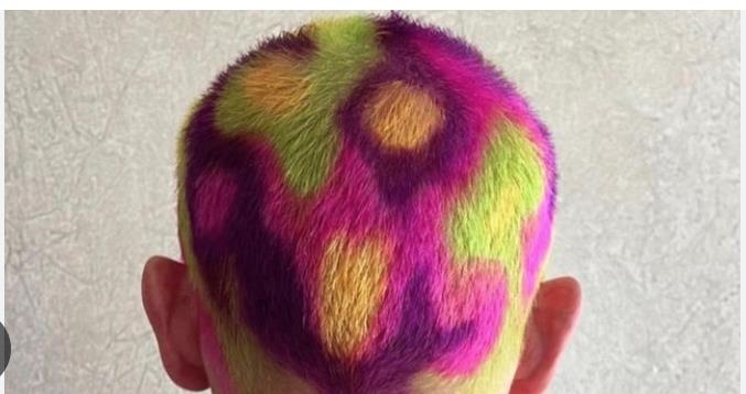 Flea is known for his wild and vibrant hair colors, often changing his look with bright Flea is known for his wild and vibrant hair colors, often changing his look with bright