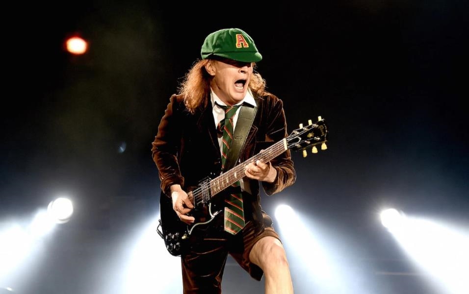 One of the most recognizable and enduring costumes in rock history is Angus Young’s schoolboy outfit One of the most recognizable and enduring costumes in rock history is Angus Young’s schoolboy outfit