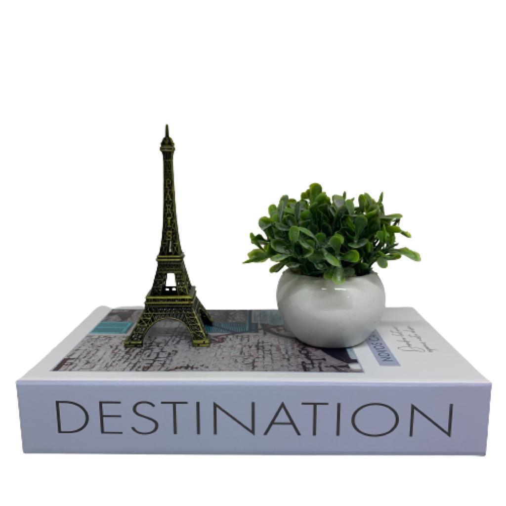 Livro decorativo Destination, vaso branco e Torre Paris