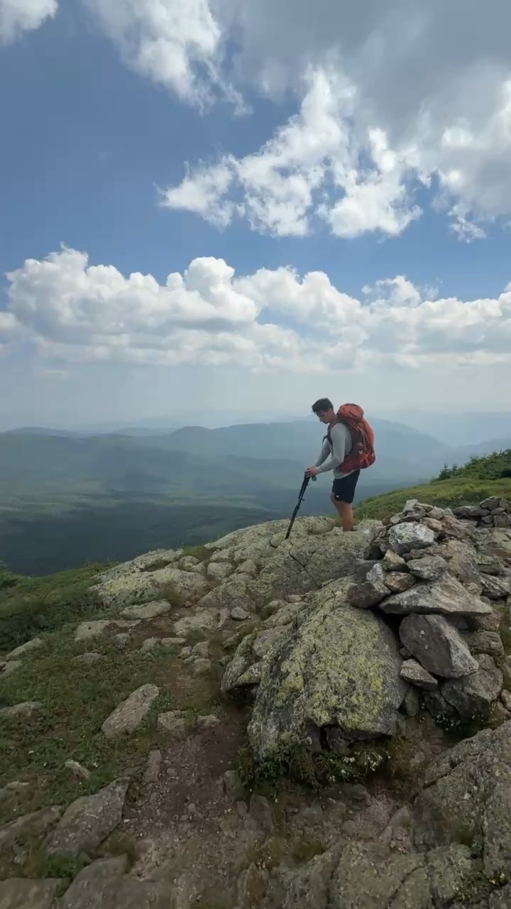 Friends hiking and exploring a beautiful outdoor mountain trail in nature