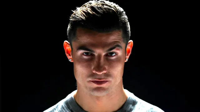 Cristiano Ronaldo Staring Intense Portrait Dark wallpaper on Pixipics