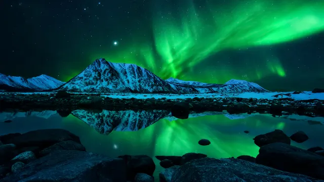 Green Northern Lights Over Icy Mountains wallpaper on Pixipics