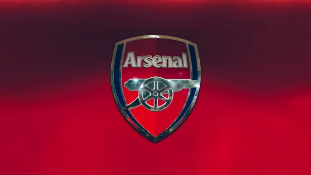Arsenal Fc Silver Metallic Cannon Logo On Red Gradient wallpaper on Pixipics