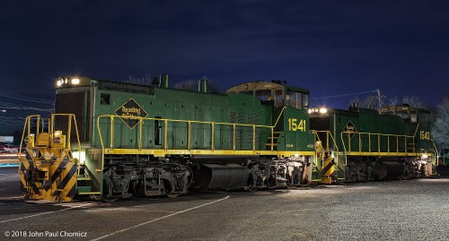 A pair of switchers rest at Outer Station, on a frigid night.