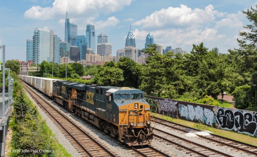 This CSX mixed freight, with a large cut of Tropicana Reefers, on front, heads south, through Philadelphia. The skyline of Center City makes for a beautiful backdrop.