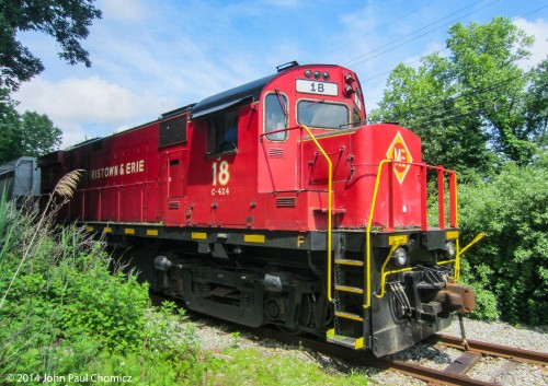 Here it is again as it peaks out through the bushes while switching some hoppers, near Rockaway.