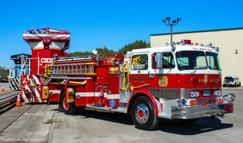 Proof that the CSX 911 was painted in the proper shade of red, is that you can't seem to tell where the locomotive ends and the pumper begins. The "Spirit of Our First Responders" and "One Helluva Hahn" seem to be as one, in this photo.