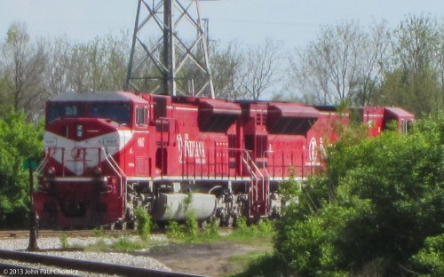 I was lucky enough to stumble upon this pair of Indiana Railroad SD90MACs, hidden in the bushes, near a crossing, in Indianapolis. Not the best shot as I was unable to get any closer with my point and shoot.