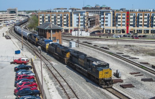 A CSX westbound mixed freight passes IU tower, in downtown Indianapolis. This tower marks the end of the Indianapolis Line and the beginning of the St. Louis Line.