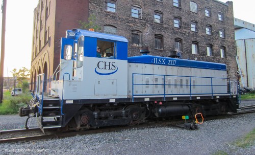 The ILSX #: 2117 provides switching services for Cenex Harvest States and is seen here idling between the massive grain silos, near the lakefront, in Superior, Wisconsin.