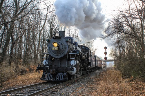 The RBM&N #: 425 has just departed the Reading Outer Station and is heading for the arch bridge over the Schuylkill River, on the first run of the day.