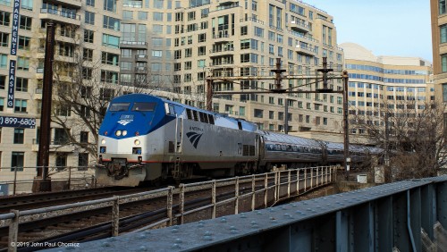 A westbound Amtrak train approaches the Potomac River Bridge after departure from Washington DC on its way to Virginia and beyond.