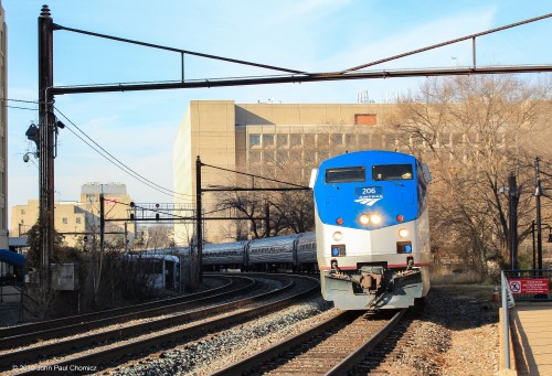 An eastbound Amtrak train rounds the curve, as it passes through L'Enfant Plaza Station, on its way to Washington DC Union Station.