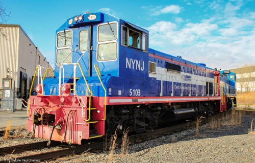 The New York New Jersey Rail is an interesting, yet obscure and highly guarded, railroad that provides switching for the industries in and around Port Jersey, as well as for the Greenville Float Yards and the new Intermodal Terminal within the yard. Here, it is seen switching an industrial siding at one of the industries. This photo was taken with permission as it is a very anti-railfan operation.