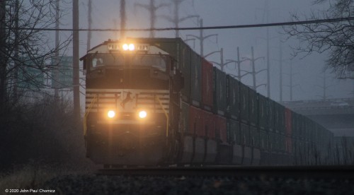 An eastbound intermodal appears, around the bend, in Wyomissing, PA.