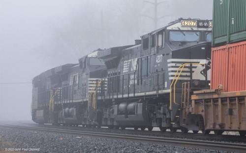 After emerging from the fog, the same westbound intermodal train heads back into the fog, in Wyomissing, PA.