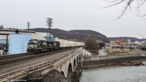 A westbound intermodal train crosses the Conemaugh River, in Johnstown, PA.