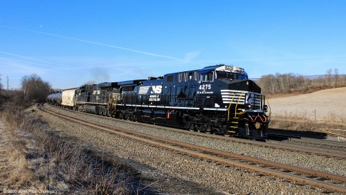 Freshly painted and recently rebuilt NS unit #: 4275 has been out of the shop, for a little over a month, as it leads this eastbound oil train, through Tipton, PA.