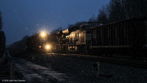 Both the coming of darkness and the snow flurries make this meet between two westbound helpers and an eastbound freight, at Lilly, PA, all the more dramatic and beautiful.