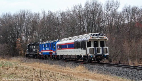 A rear end photo, at the same location, shows all the inspection instruments that are in use, probing the tracks, as it heads south.