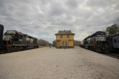 3026 shoves a cut of tank cars for storage down the Cape May Branch while the 5271 waits for the 3026 to couple back up