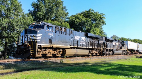 This westbound TOFC train is led by a Norfolk Southern unit with an unusual feature. Unlike the other NS units, the number boards are black with white numbers. This was an error by the manufacturer, GE, when these units were ordered. Though I personally like the black number boards better, NS didn't, and replaced them all with the normal white number boards with black numbering.