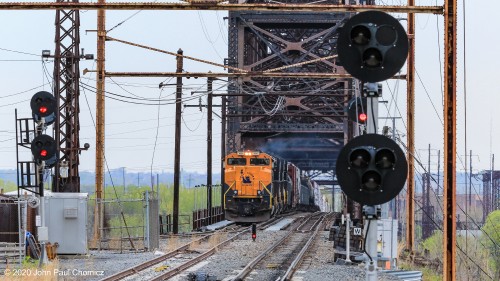 Train 39G framed by the signals of the NJT Atlantic City Line as it arrives on the Jersey side of the bridge, in Pennsauken, NJ.