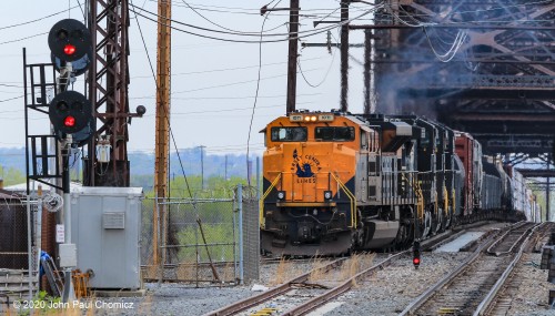 Another close-up view of Train 39G, with Liberty leading, before it is obscured by the fence, as it exits the AC line and heads towards the River Line.