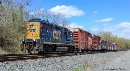 An unknown local heads south, on the National Docks Secondary, with seven box cars, in tow. It is possibly the Bayonne Local that transfers cars between South Kearny Yard and Bayonne Yard. Oddly, the power has two wide dimensional load red flags, on it, and it doesn't quite look like these cars meet that criteria.