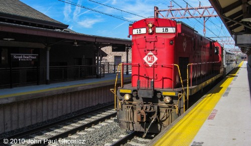 M&E #: 18 pulls a private passenger car east, through Newark Broad Street Station, towards the CSX interchange, in Harrison, NJ. Unfortunately, this is a sight that can no longer be seen as the M&E #: 18 is no longer in service with the railroad.