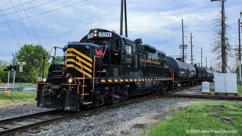 After exiting the Winchester and Western Main, Local #: J101 heads south on the Vineland Secondary, crossing over the diamond with the old CNJ southern railroad right-of-way which heads to Winslow Junction.