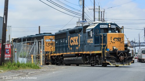 After switching Brill's Junction, this train is literally, "full of shit". Brill's Junction is where the treated sewage, from the Newark Sewage Treament Plant, is loaded onto Epic cars bound for points west, to be turned into fertilizer. Here, the local crosses Doremus Avenue, on its way back to Oak Island, with its precious, "load".