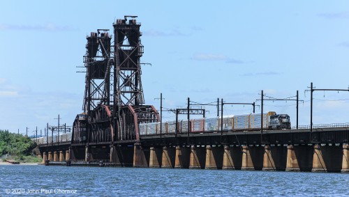 Shortly after the departure of Q433, this Oak Island local appeared with a set of autoracks for the Doremus Avenue Auto Terminal, in Newark, NJ. It will pull onto the bridge and, once it clears the switch, will back up into the terminal, out of view, to the left of the photo.