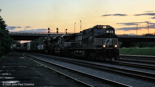 Even with the longer daylight, this eastbound intermodal train comes through late enough to challenge the limits of my camera. The colors of the setting sun make a good backdrop for the darkness of this train, as it passes through Bethlehem, PA.