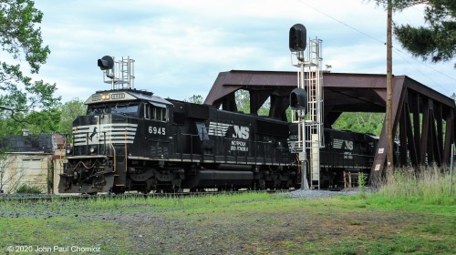 Norfolk Southern unit #: 6945 is at the point of this, soon to depart, westbound mixed freight train. It's seen at Canal Park in Allentown, PA.