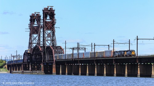 The Upper Bay Drawbridge crosses the Newark Bay, creating a link between Oak Island Yard and Greenville Yard/National Docks Secondary/Bayonne Industrial Track. Here, Oak Island to Selkirk CSX train #: Q433 pauses on the bridge before doubling up to the rest of its train.